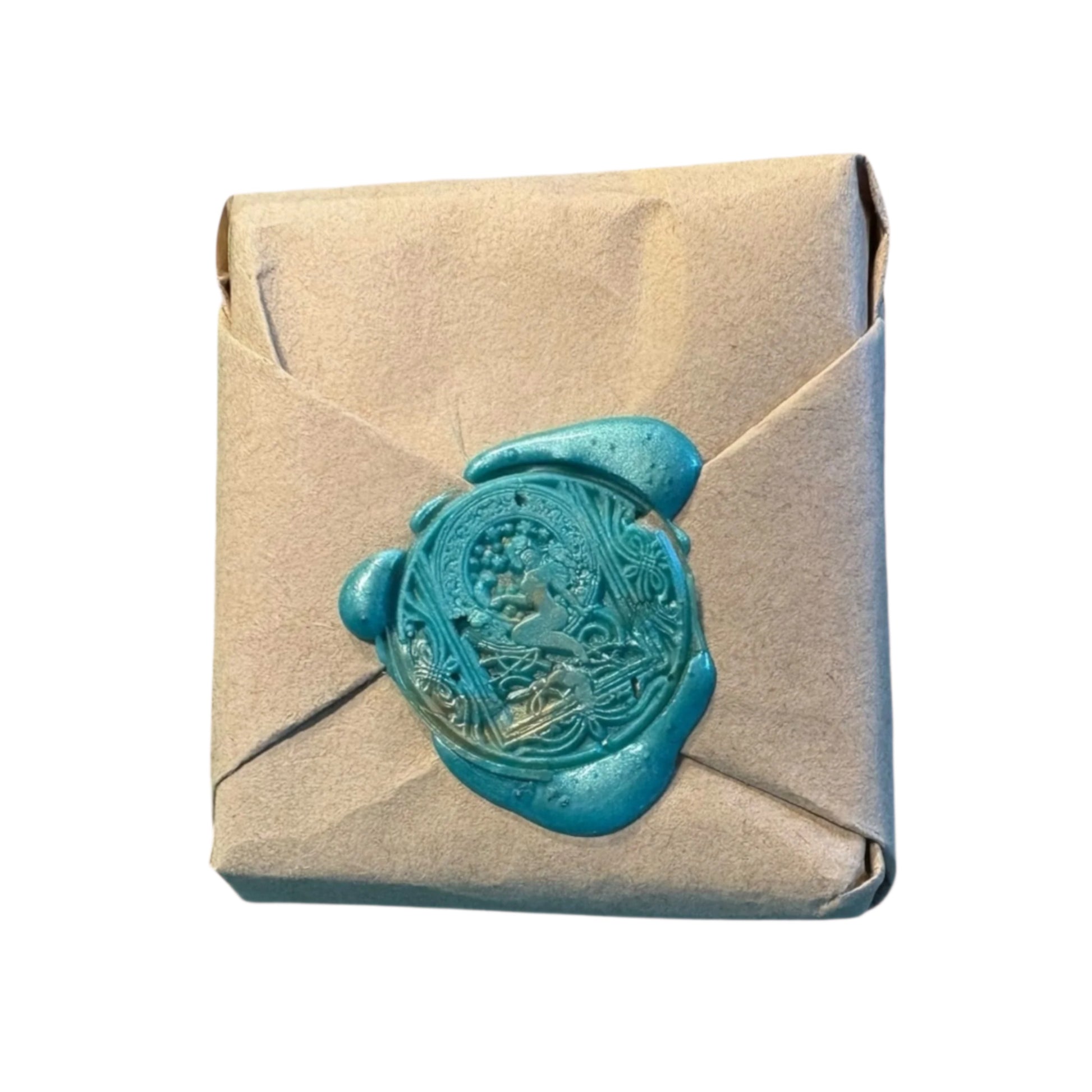 Eco Friendly kraft paper shampoo bar wrapped in Beige kraft paper with a blue wax seal on a white background