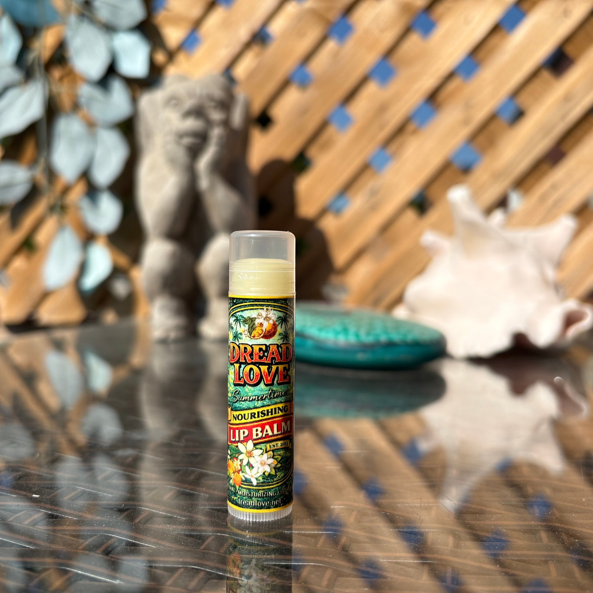 A tube of Dread Love Lip Balm, Summertime Flavour, creamsicle