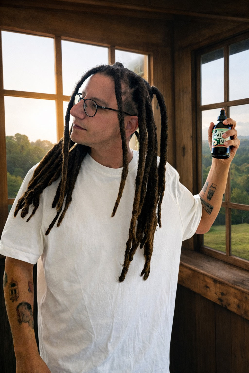 Client using Dread Love Sea Spray for loc maintenance – handcrafted formula with natural ingredients