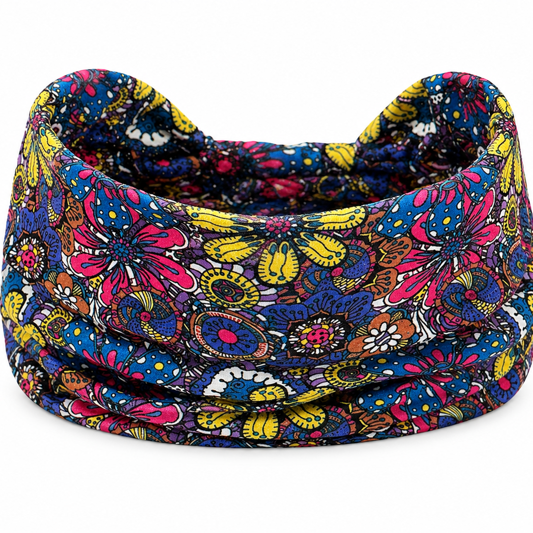 A purple multicolor floral patterned dreadlock fabric headband with a blue, pink, yellow, and orange paisley design, shown on a plain white background.
