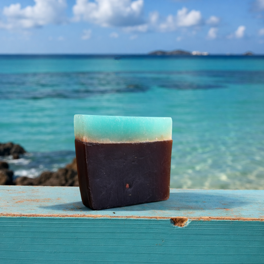 shampoo Bar of soap with a gradient from blue to brown on a wooden surface with ocean in the background