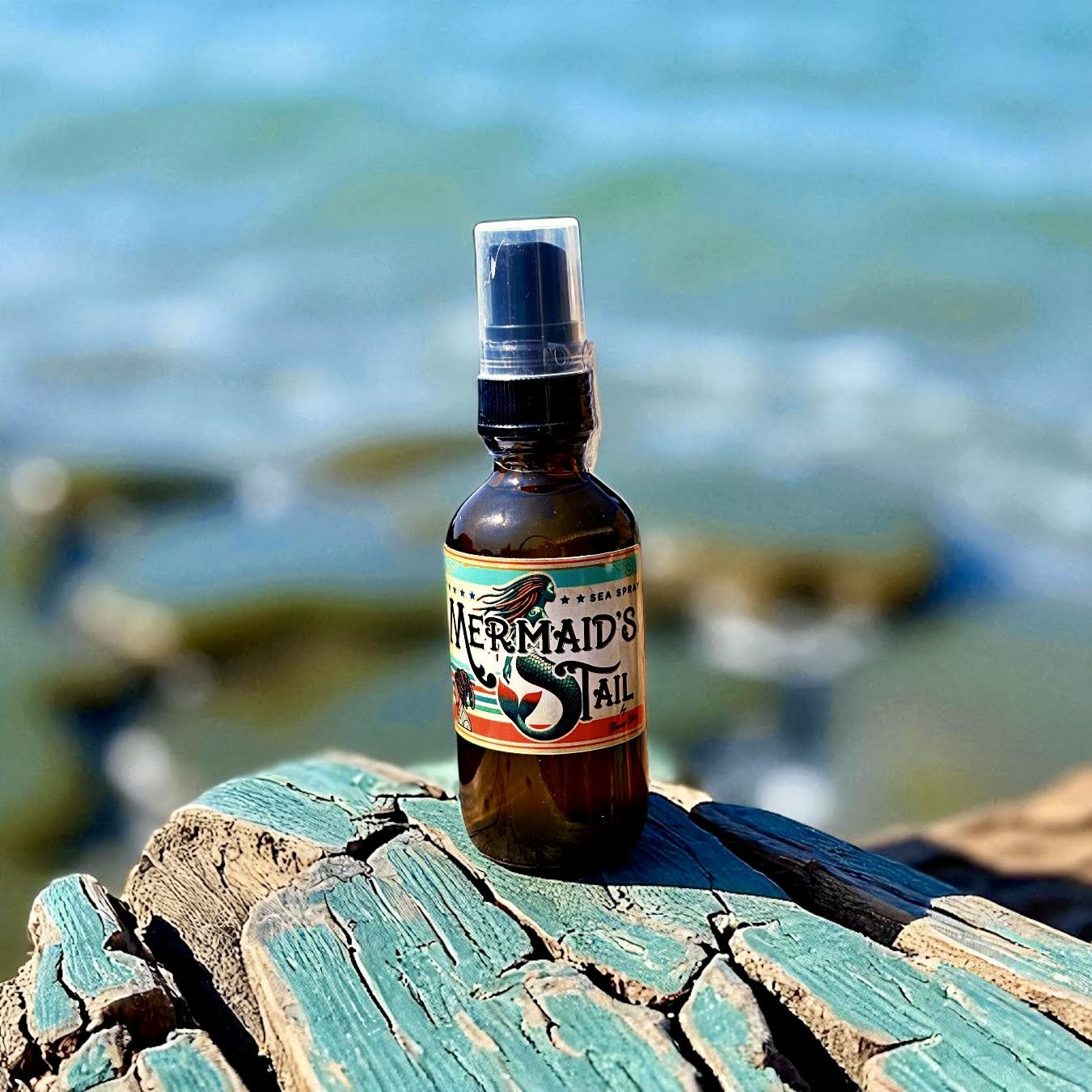 2 oz Sea Spray by Dread Love – small batch, residue-free loc refresher in a recyclable glass bottle on driftwood