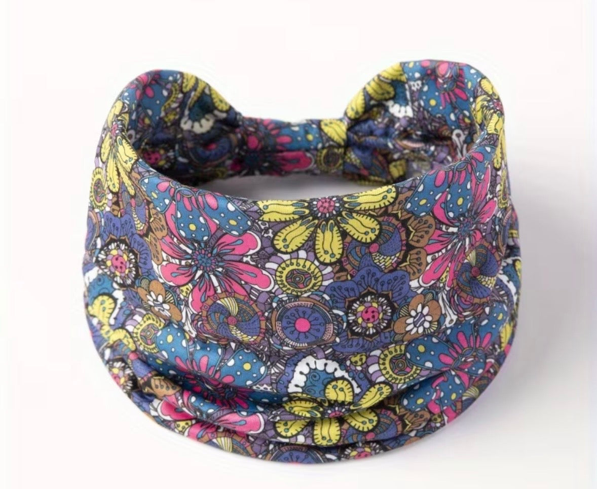 Colorful floral-patterned fabric wrap on a white background